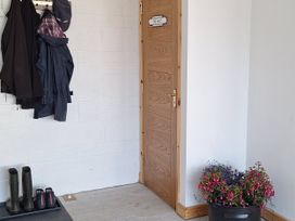 An entrance with a door and a coat rack at The Halt Maiden Newton