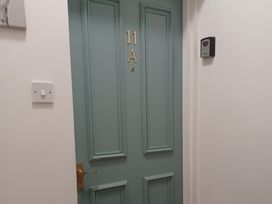 A door with number 11A and a keypad at 11A High Street in Jedburgh