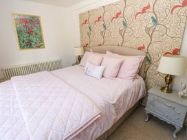 A bedroom with a bed and furnishings at The Museum in Nenthead