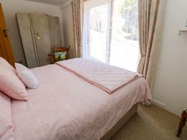 A bedroom with bed and wardrobe at The Museum in Nenthead