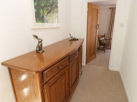 A hallway with a console table and two rabbit figurines at The Museum in Nenthead