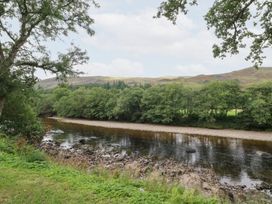 A river with trees and hills at Bradan Lodge Dalmally