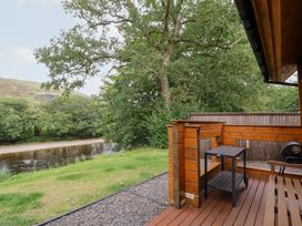 An outdoor space with a view of a river at Bradan Lodge Dalmally