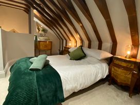 A bedroom with a bed and bedside tables at St Edmunds Church in Fraisthorpe