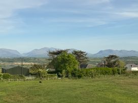 A view of mountains and fields near Llangristiolus at 15 Llys Tegeirian Llangristiolus near Llangefni