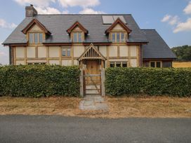 A house with a hedge and front door in Montgomery