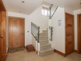 An entryway with a staircase and doors at the White House in Montgomery