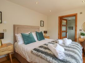 A bedroom with a bed and nightstands at White House in Montgomery