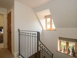 A staircase with a handrail and windows at White House in Montgomery