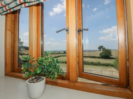 A window with a view of the countryside and a potted plant at White House in Montgomery