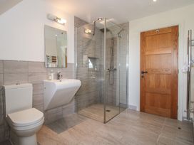 A bathroom with a shower and wash basin at White House in Montgomery