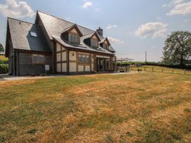 A house with a patio and surrounding grass at White House in Montgomery