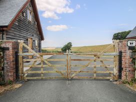 A wooden gate and driveway in front of a house at White House in Montgomery