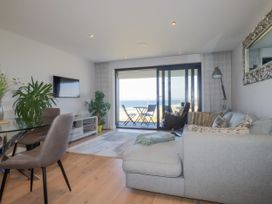 A living room with a sofa and a tv at Apartment 8 in 