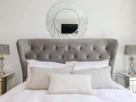 A bedroom with a bed and decorative pillows at Apartment 8