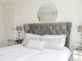 A bedroom with a bed and bedside tables at Apartment 8 in 