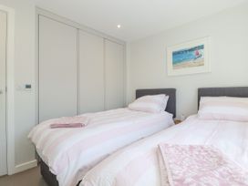 A bedroom with two beds and a wardrobe at Apartment 8 in 