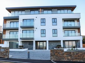 A building with balconies and an entrance at Fistral House in Newquay
