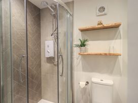 A bathroom with a shower and toilet at Daffodils in Ambleside