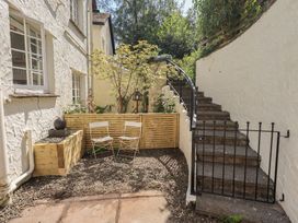 An outdoor area with stairs and chairs at Daffodils in Ambleside