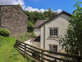 An outdoor view of a house with a fence in Daffodils Ambleside