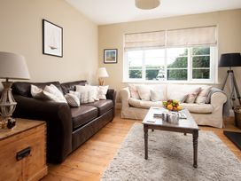 A living room with a sofa and coffee table at Driftwood in Embleton