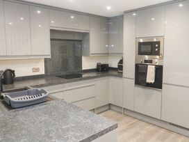 A kitchen with a sink and appliances at Boslowen Portreath