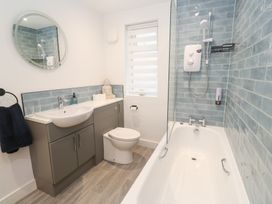 A bathroom with a sink and a bathtub at Boslowen in Portreath
