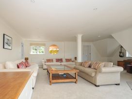 A living room with sofas and a coffee table at Bodare 8 in Daymer Bay