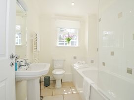 A bathroom with a sink, bathtub, and toilet at Bodare 8 Daymer Bay