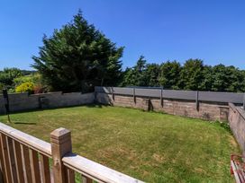 A garden with grass and trees at West View Northlew near Hatherleigh