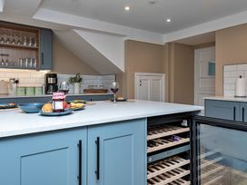 A kitchen with a wine cooler and coffee maker at Snowdonia Manor in Dolgellau