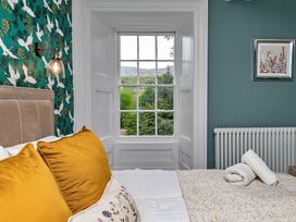 A bedroom with a window and bed at Snowdonia Manor in Dolgellau