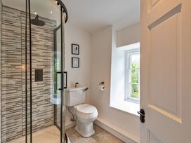 A bathroom with a shower and toilet at Snowdonia Manor in Dolgellau