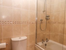 A bathroom with a bathtub and shower at Swallows Reach Halwell