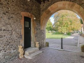 An entrance with a stone wall and a door at The Clock Tower in Rousdon, Nr Lyme Regis
