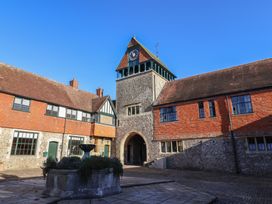 A courtyard with a clock tower and fountain at The Clock Tower in Rousdon, Nr Lyme Regis