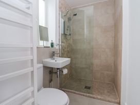 A bathroom with a shower and sink at Pear Tree Cottage in Great Ouseburn