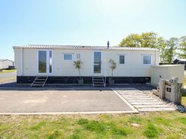 A mobile home with window and door at MillRythe Holiday Park (Dunlin Walk 13) Hayling Island