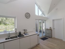A kitchen with a sink and kettle at Kerrek Lodge Mylor Bridge