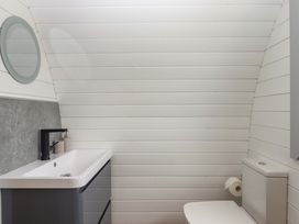 A bathroom with a sink and toilet at Under Oak Pod Totnes