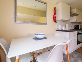 A kitchen with a table and chairs at H2 Atlantic Bay Holiday Park Padstow