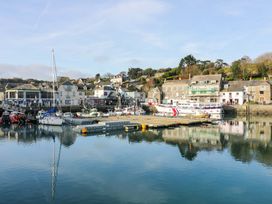 A harbor with boats and buildings at H2 Atlantic Bay Holiday Park in Padstow