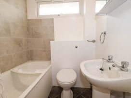 A bathroom with a bathtub, toilet, and sink at 161 Atlantic Bay Holiday Park Padstow