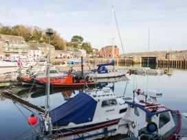 A harbor with boats and buildings at 161 Atlantic Bay Holiday Park in Padstow
