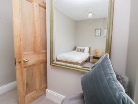 A bedroom with a bed and nightstand at Sunnycroft in Keswick