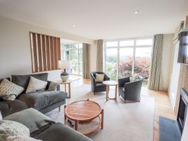 A living room with a sofa and coffee table at Rowanhill in Kendal