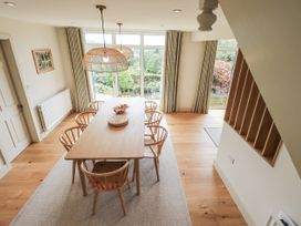A dining room with a table and chairs at Rowanhill in Kendal