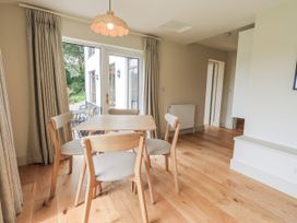 A dining room with a table and chairs at Rowanhill in Kendal
