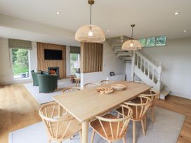 A dining room with a table and chairs at Rowanhill in Kendal